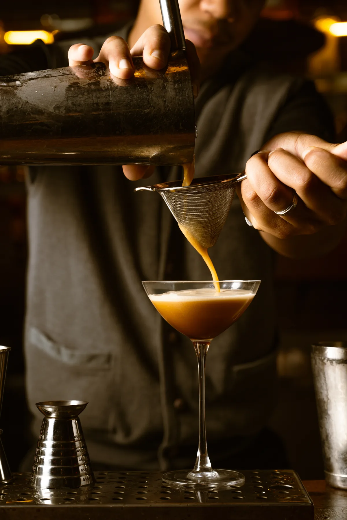 Bartender pouring a cocktail at La Cale