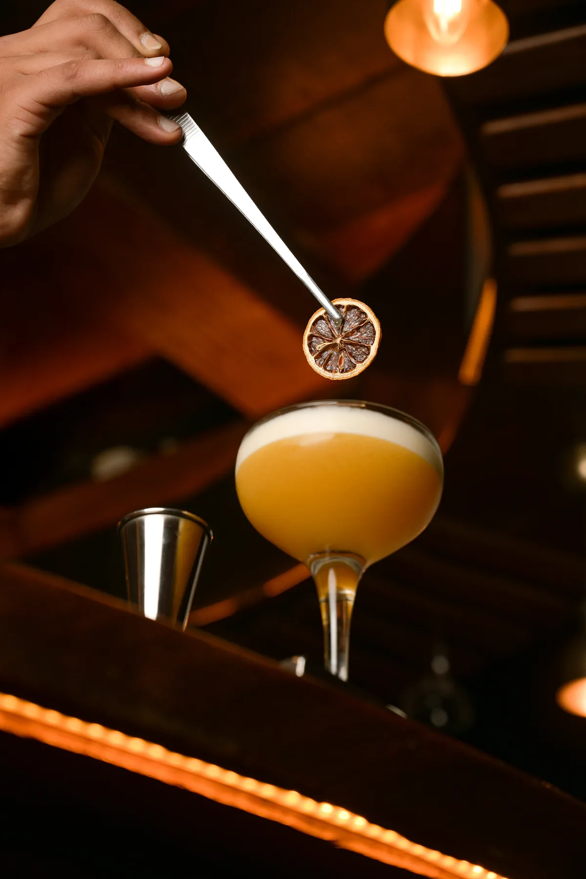 Garnishing a cocktail at La Cale